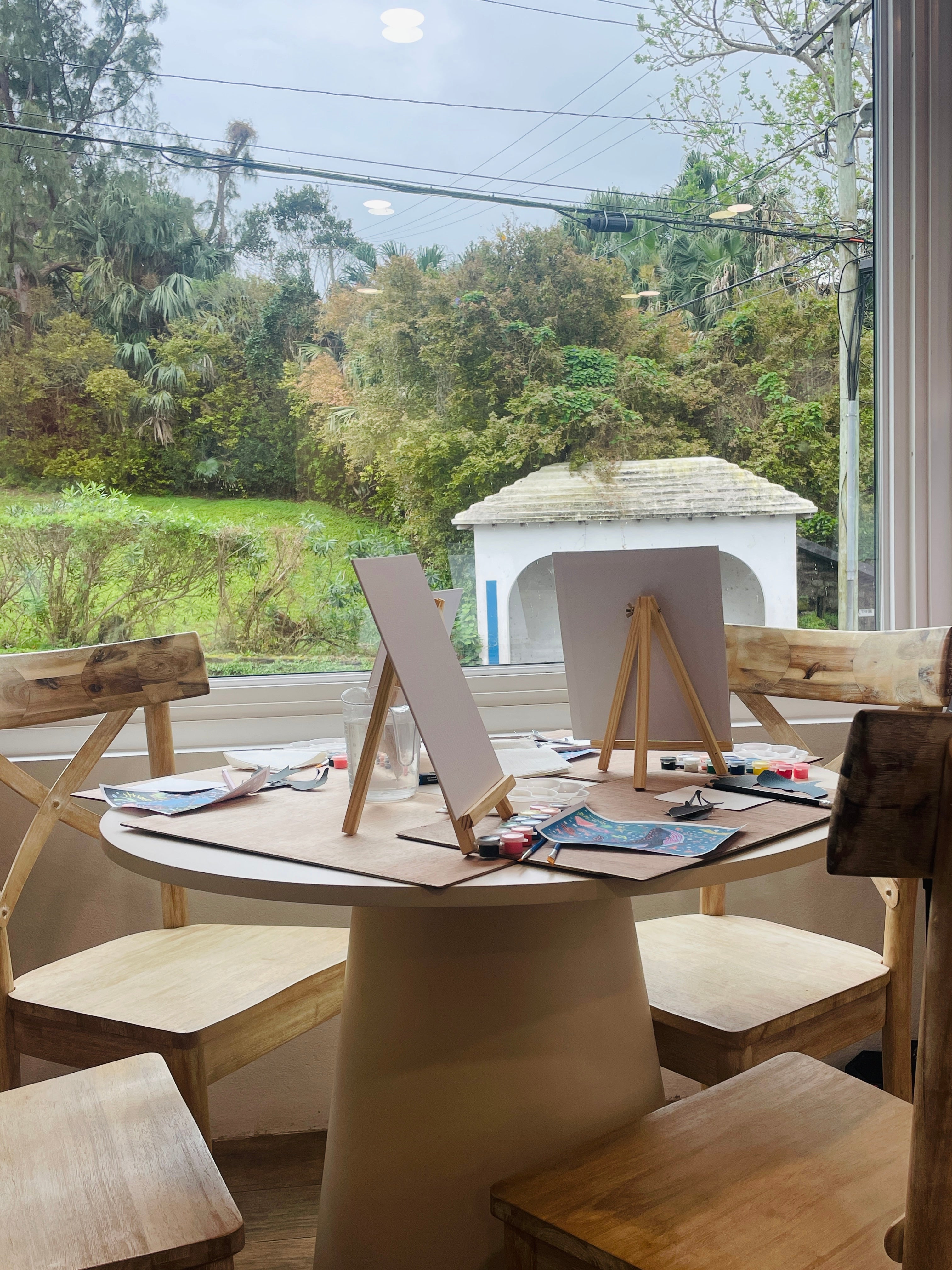 Workshop session at a table with art